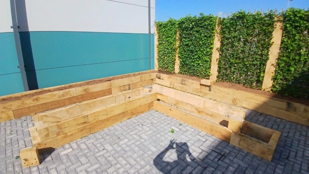 Corner wooden plant beds