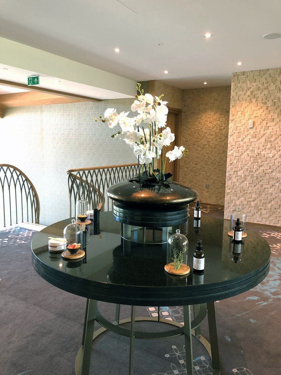 black table with white flowers in the middle