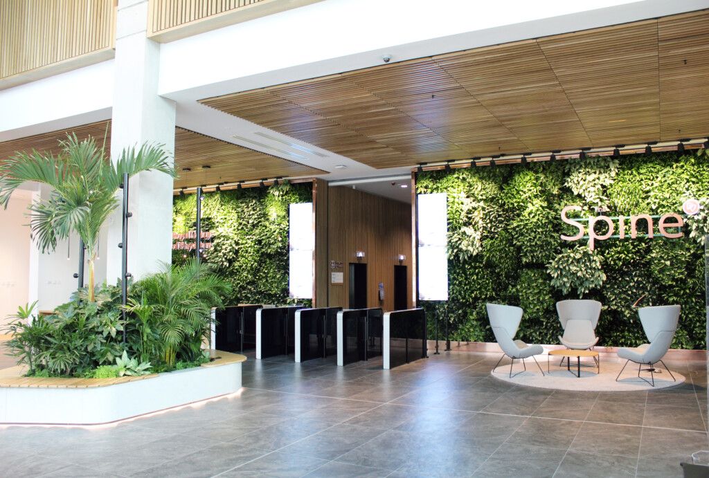 Open space with plant wall written spine