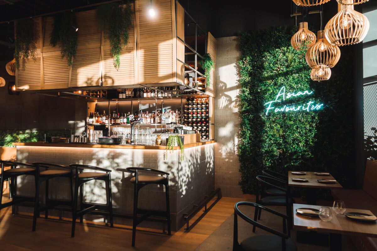 bar with plant wall in the back