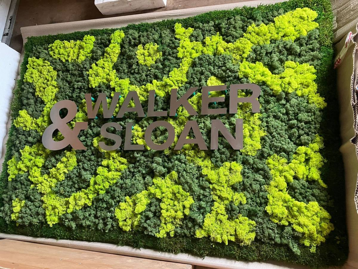 Moss art with company name in it