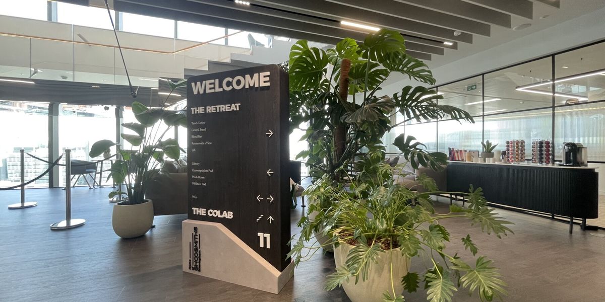 pot plants next ot a welcome sign