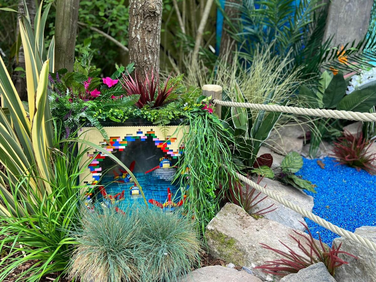outdoor green plants with art piece