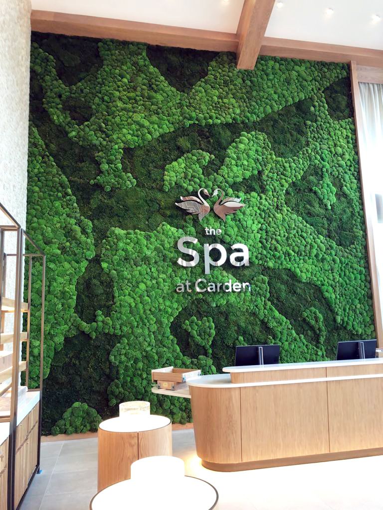 moss wall with the spa at carden written on it