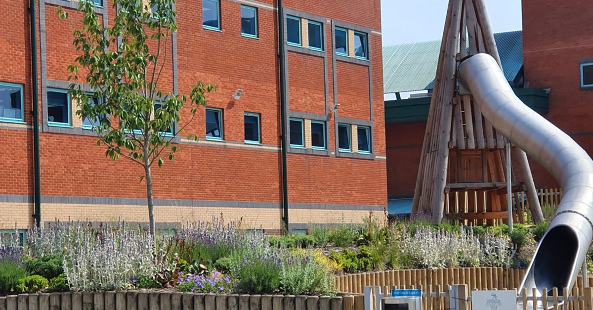 play area behind a brick building