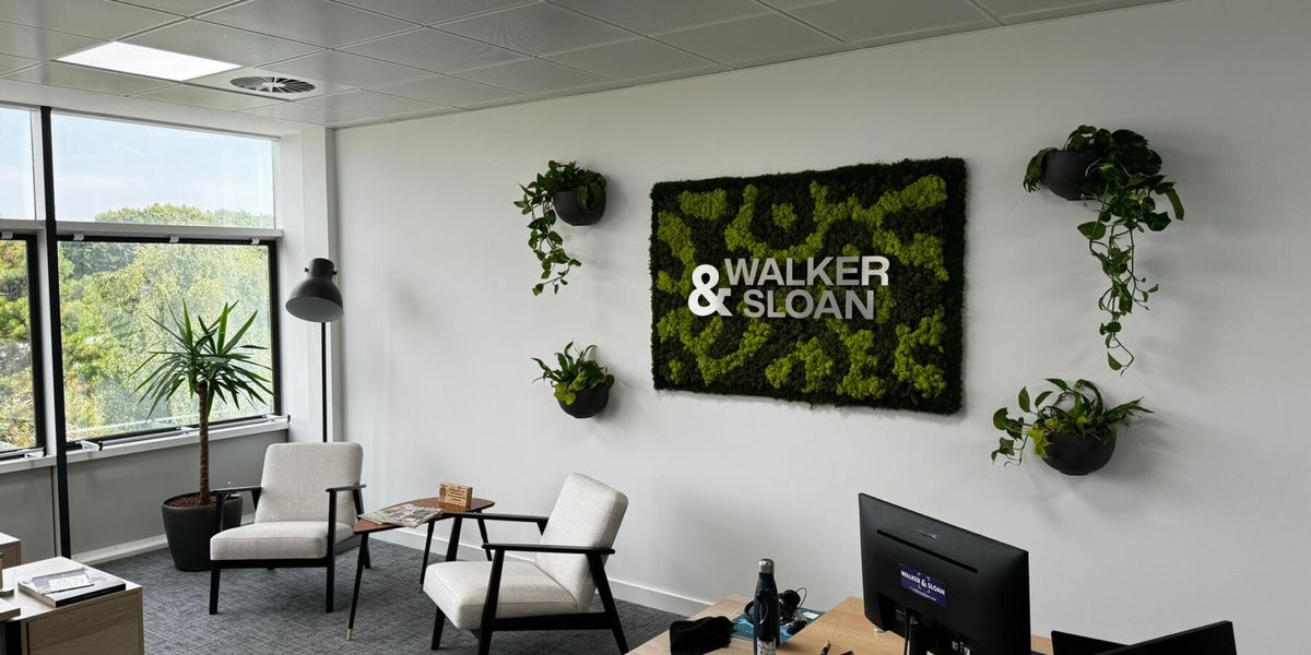 Wall moss art in a seating area in an office