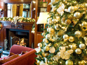 close up christmas tree with decorated room