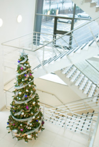 lonf christmas tree by the stairs