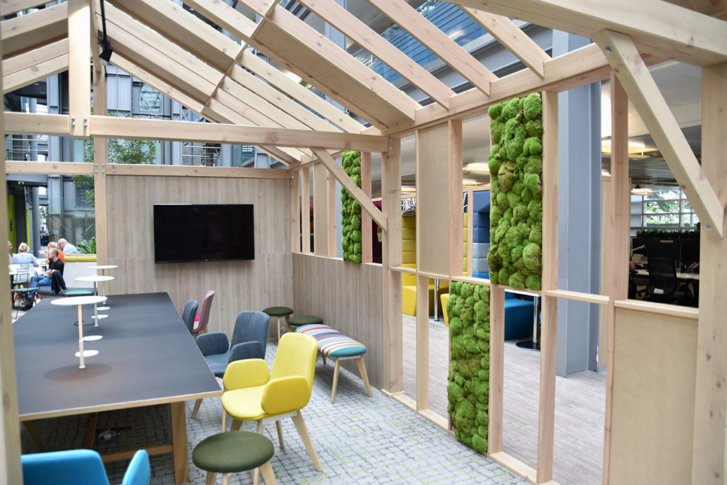 wooden shelter with plants in the walls