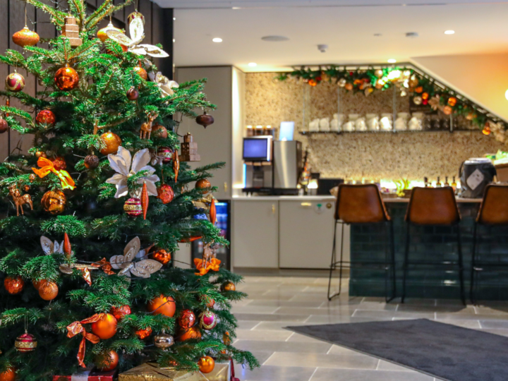 Urban Planters Christmas tree install with glod, orange and white decorations on the tree