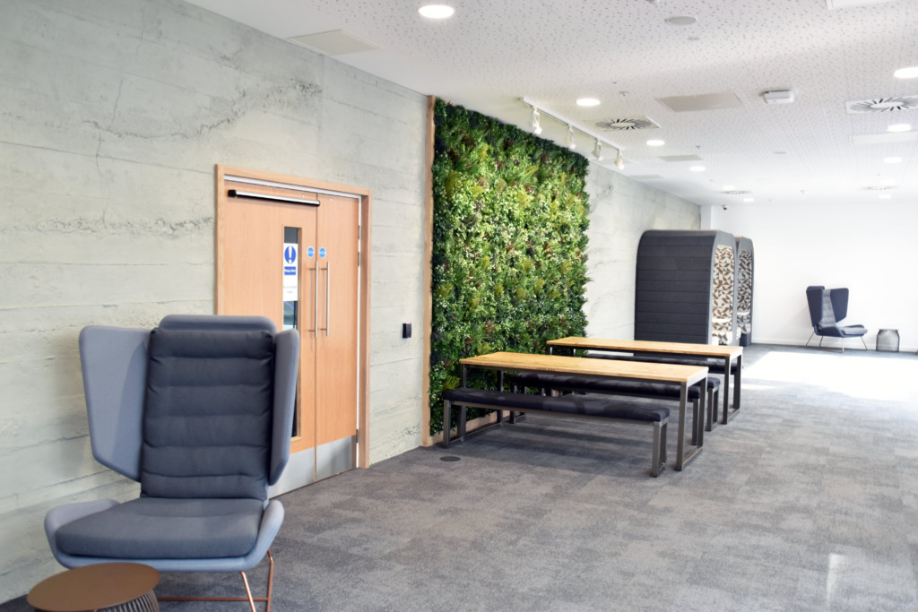 plant wall and woden tables