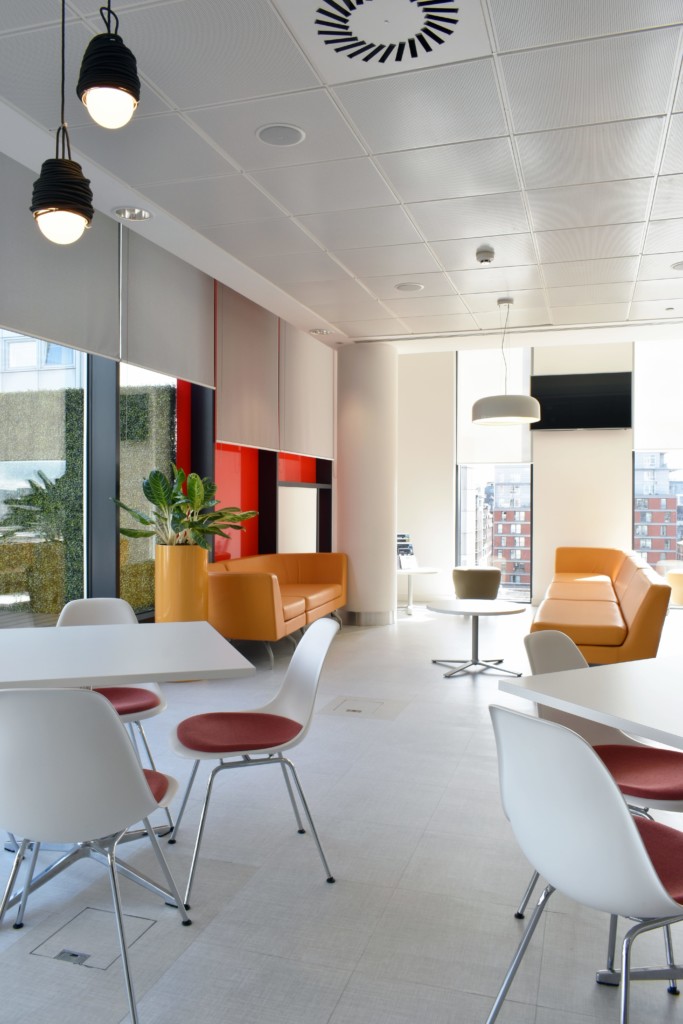 sitting area with orange pieces and a plant