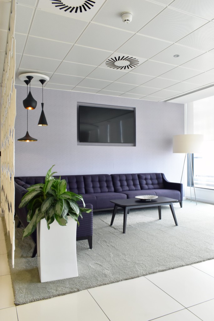 sitting area with a couch and indoor plant