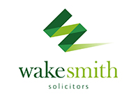 wakesmith solicitors text in green and white background