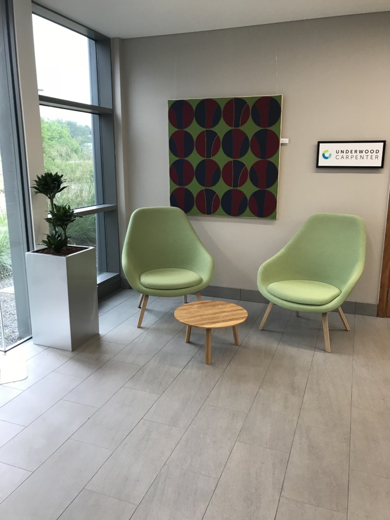 waiting area with indoor plant next to the sit