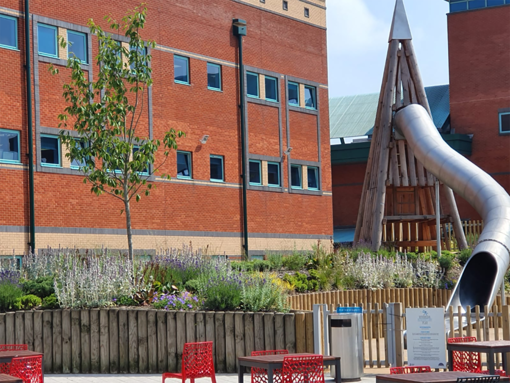 play area behind a brick building