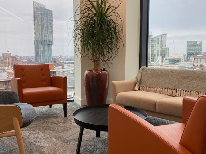 sitting area with a plant in the corner and a lovely view