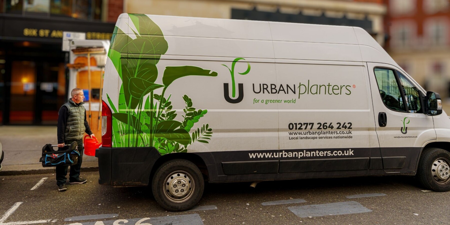 Urban Planters van standing in the street outside of a building in the UK